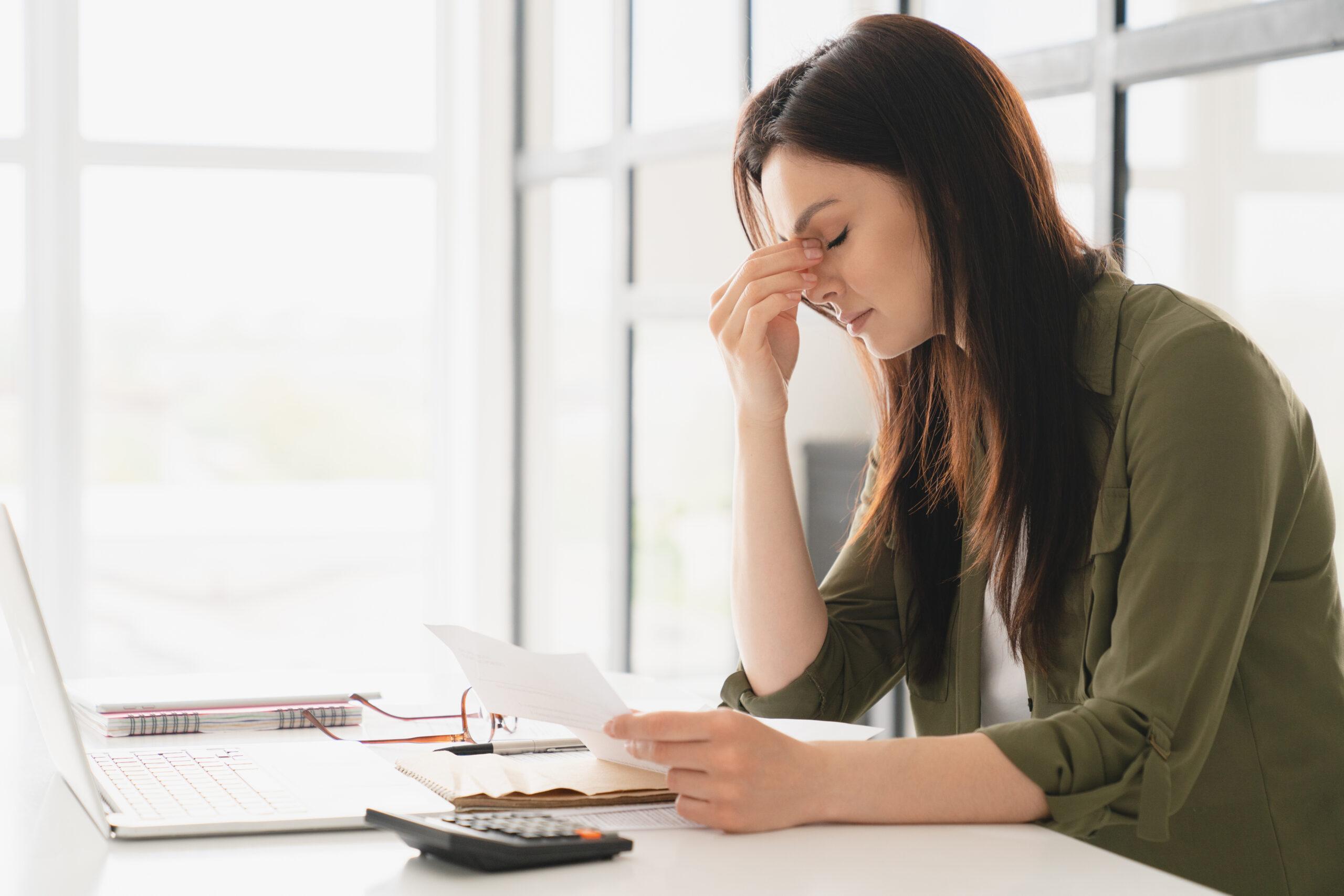 Young tired stressed woman because of limited funds for reasearch