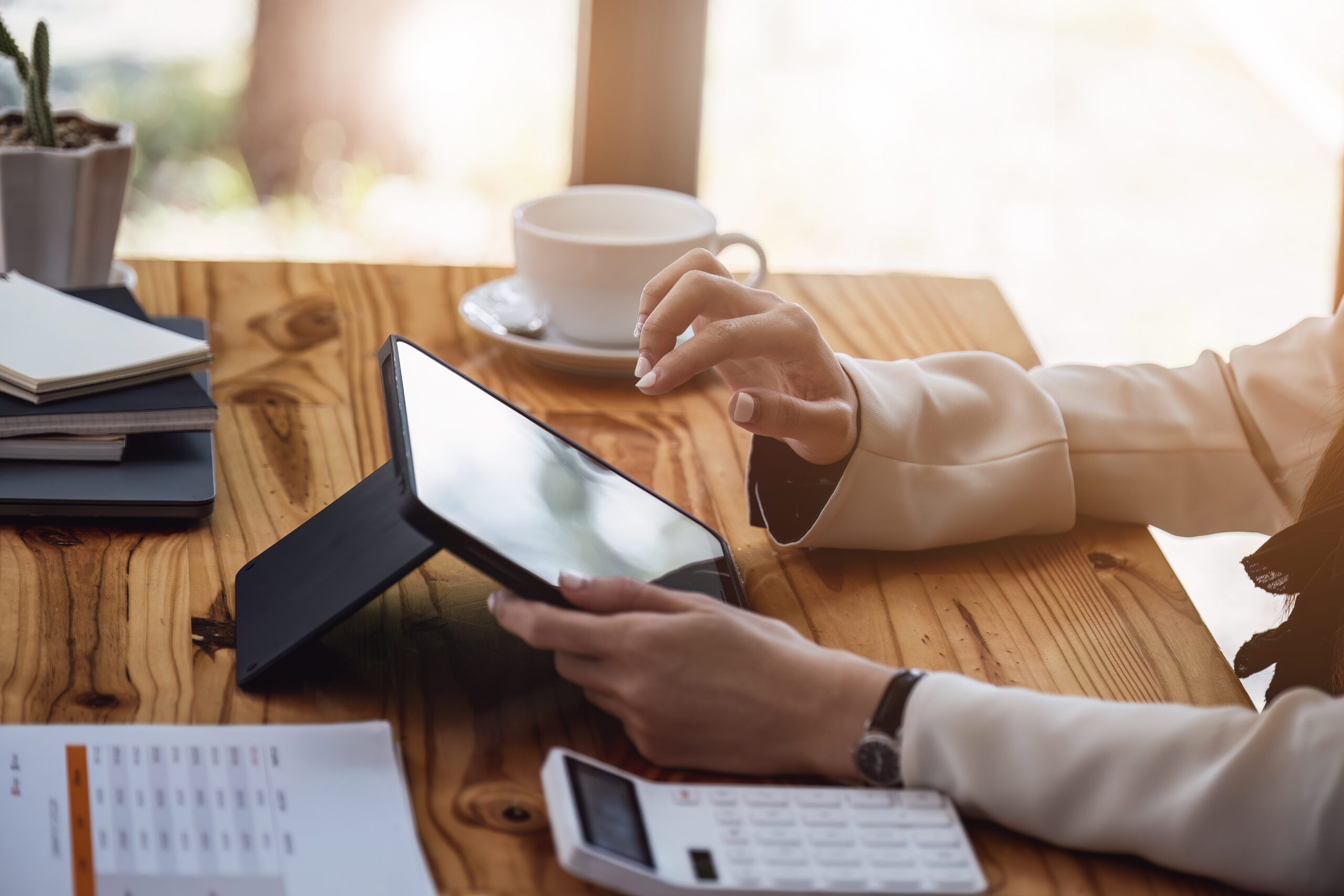 Business woman using a tablet computer for data analysis