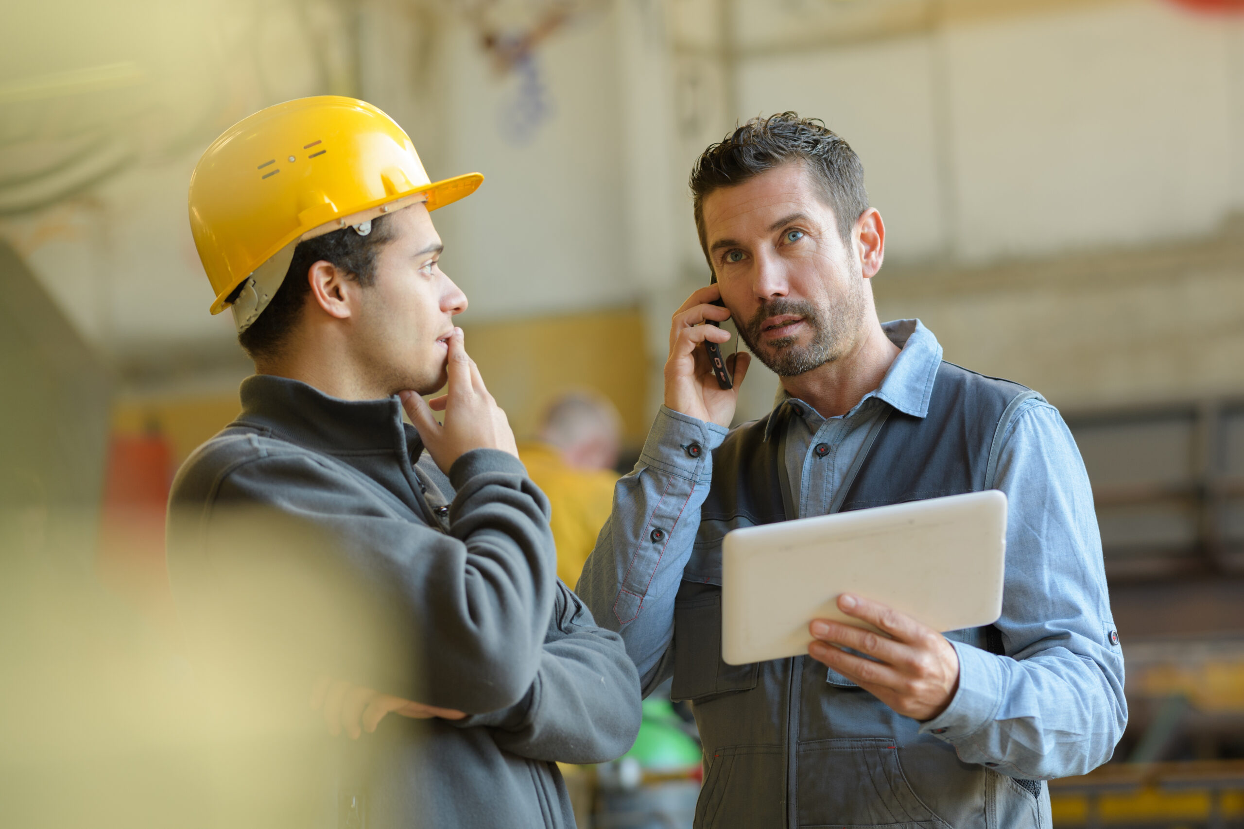 male technician or engineer on a phone call 