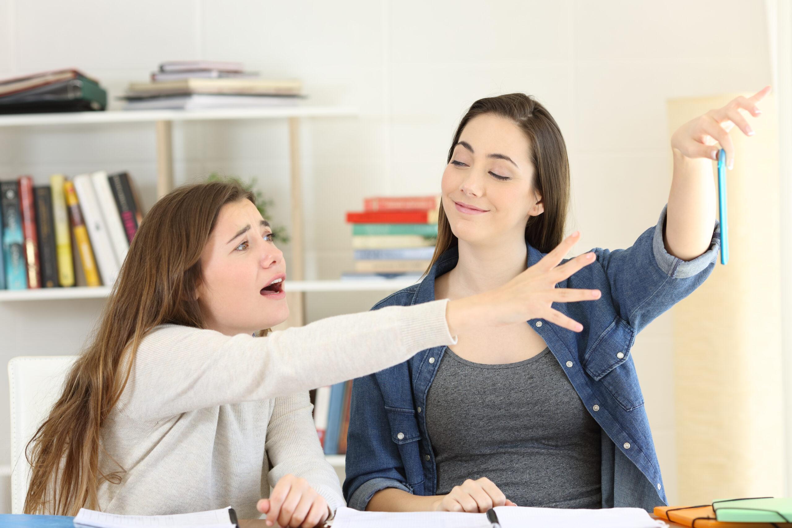 Sisters fighting for a mobile phone