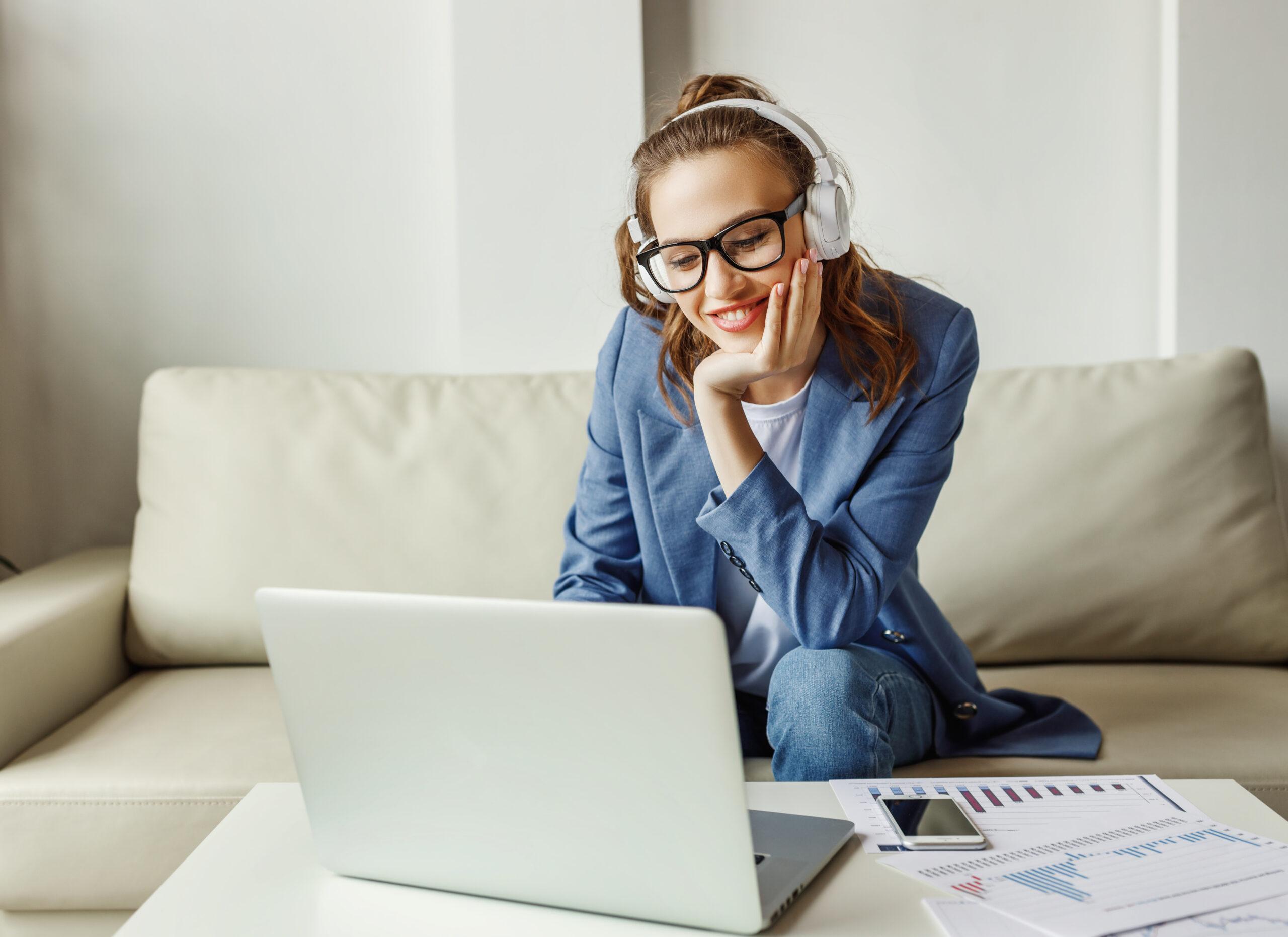 Excited busy woman talking with colleague in video chat