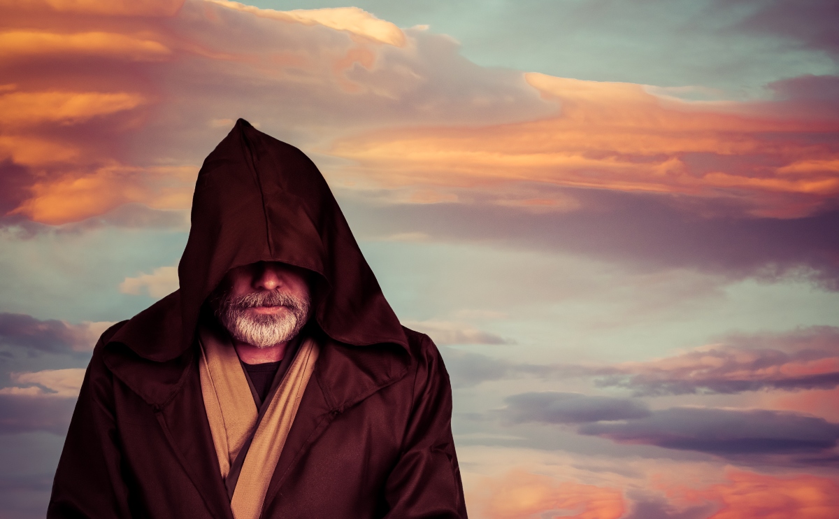 Star Wars fan in Luke Skywalker Jedi costume from the sequel trilogy