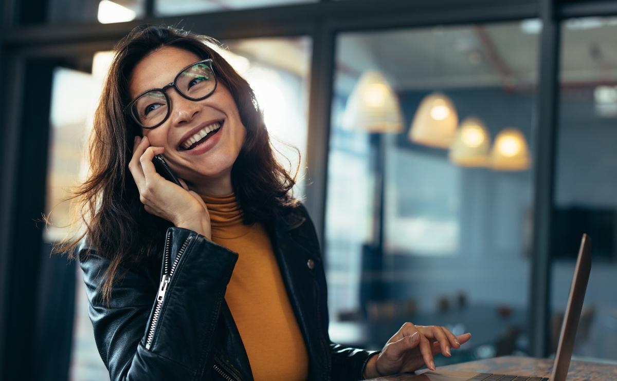 Happy woman talking on the phone