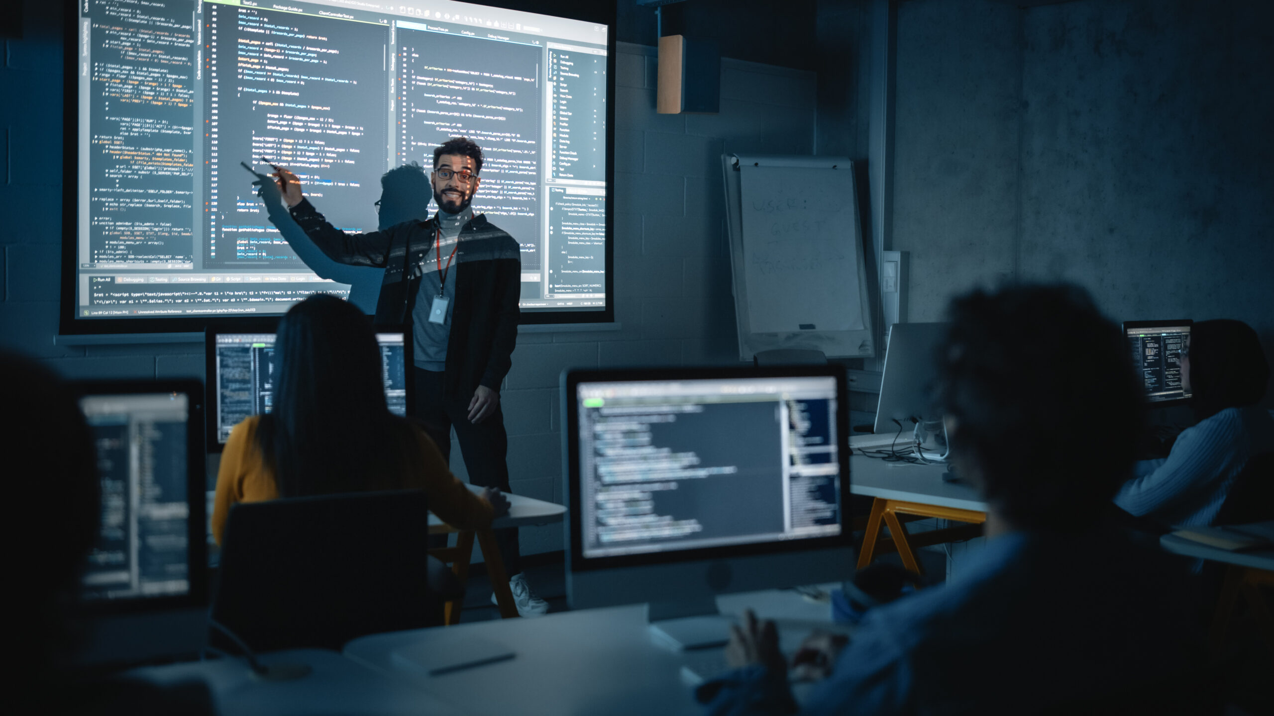 Teacher giving computer science lecture 