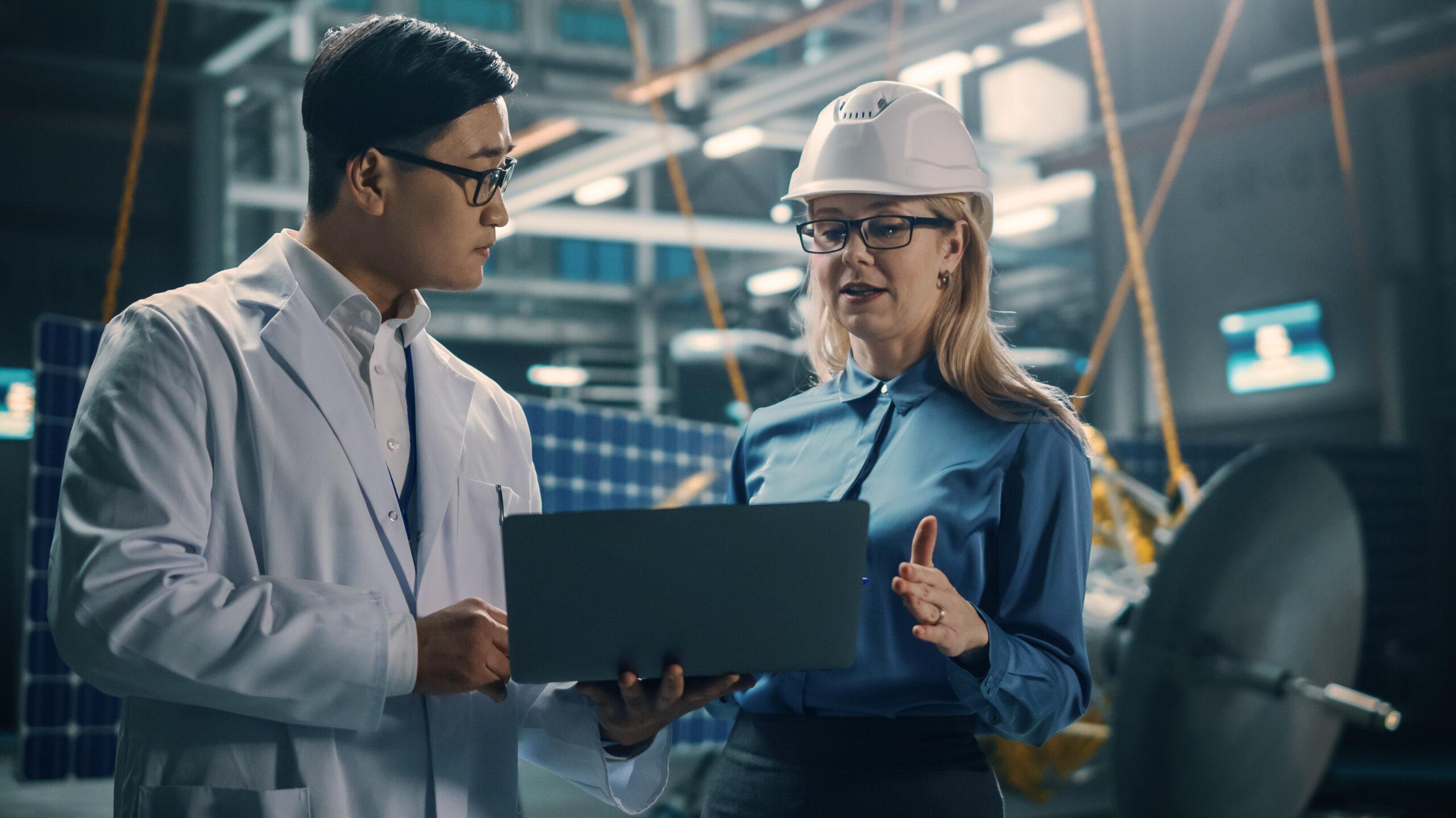 Team leader of engineers giving feedback to one of her members