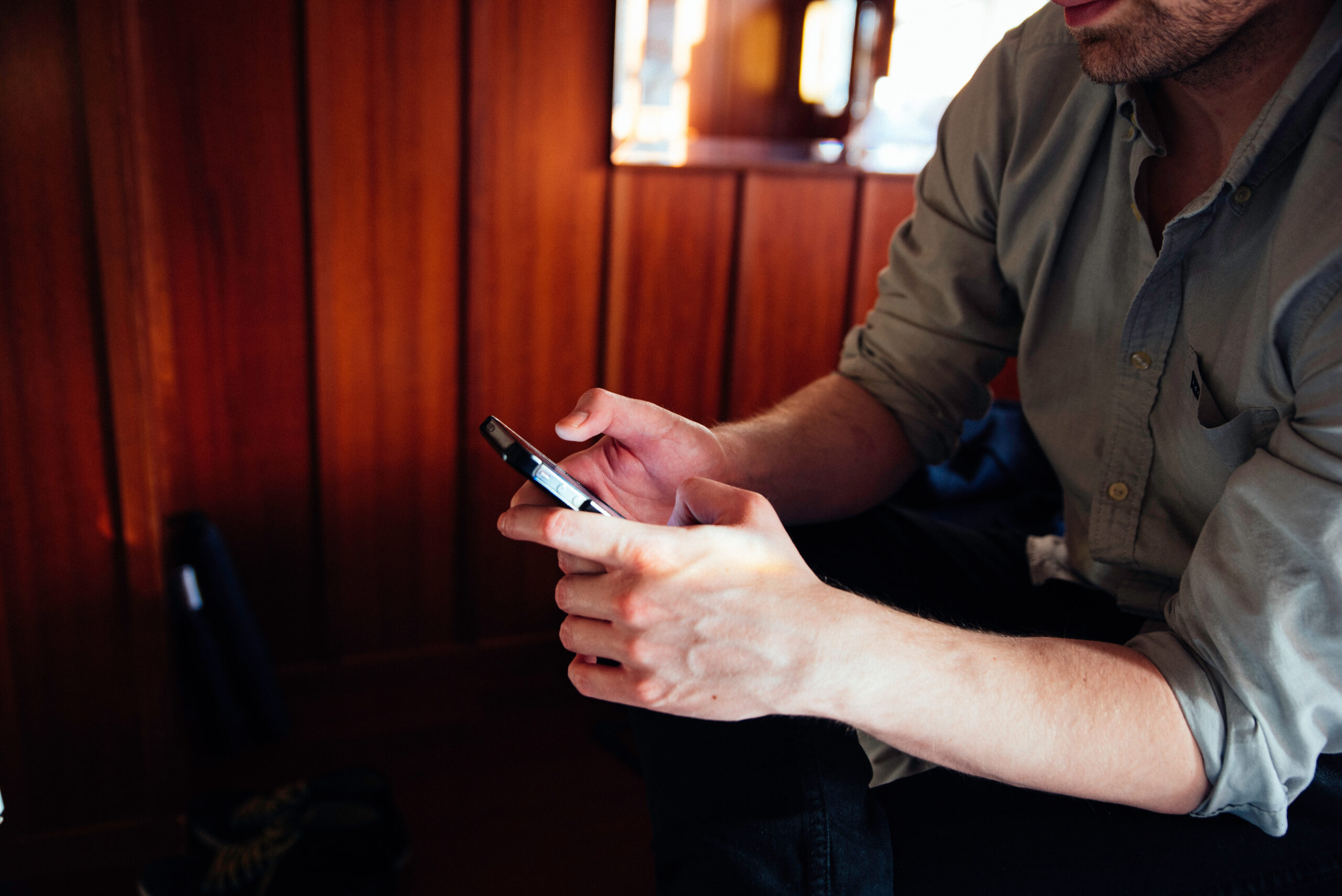 A young male using a phone