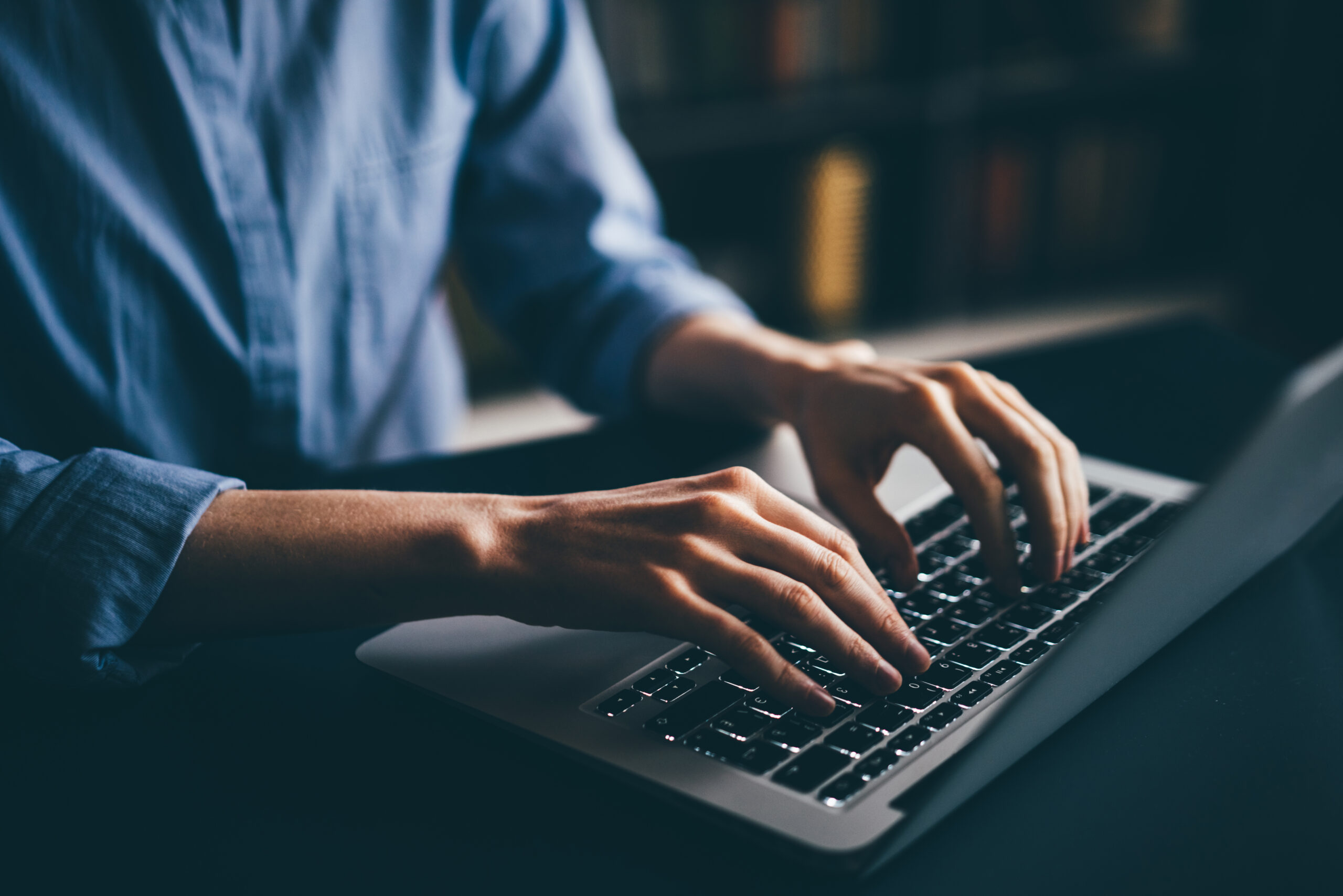 Woman typing on keyboard