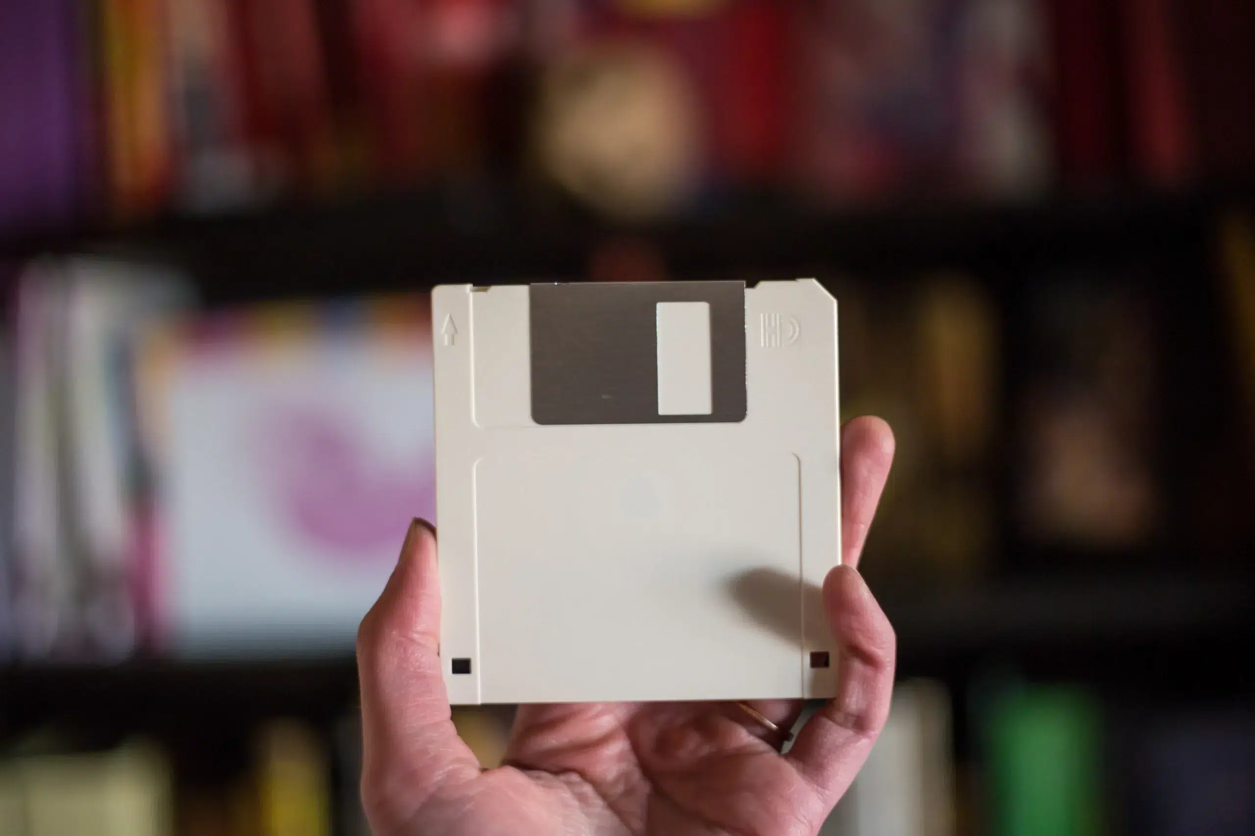 Woman holding 3.5" floppy disk
