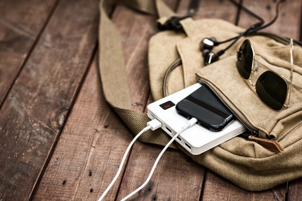 Charging smartphone with a power bank.