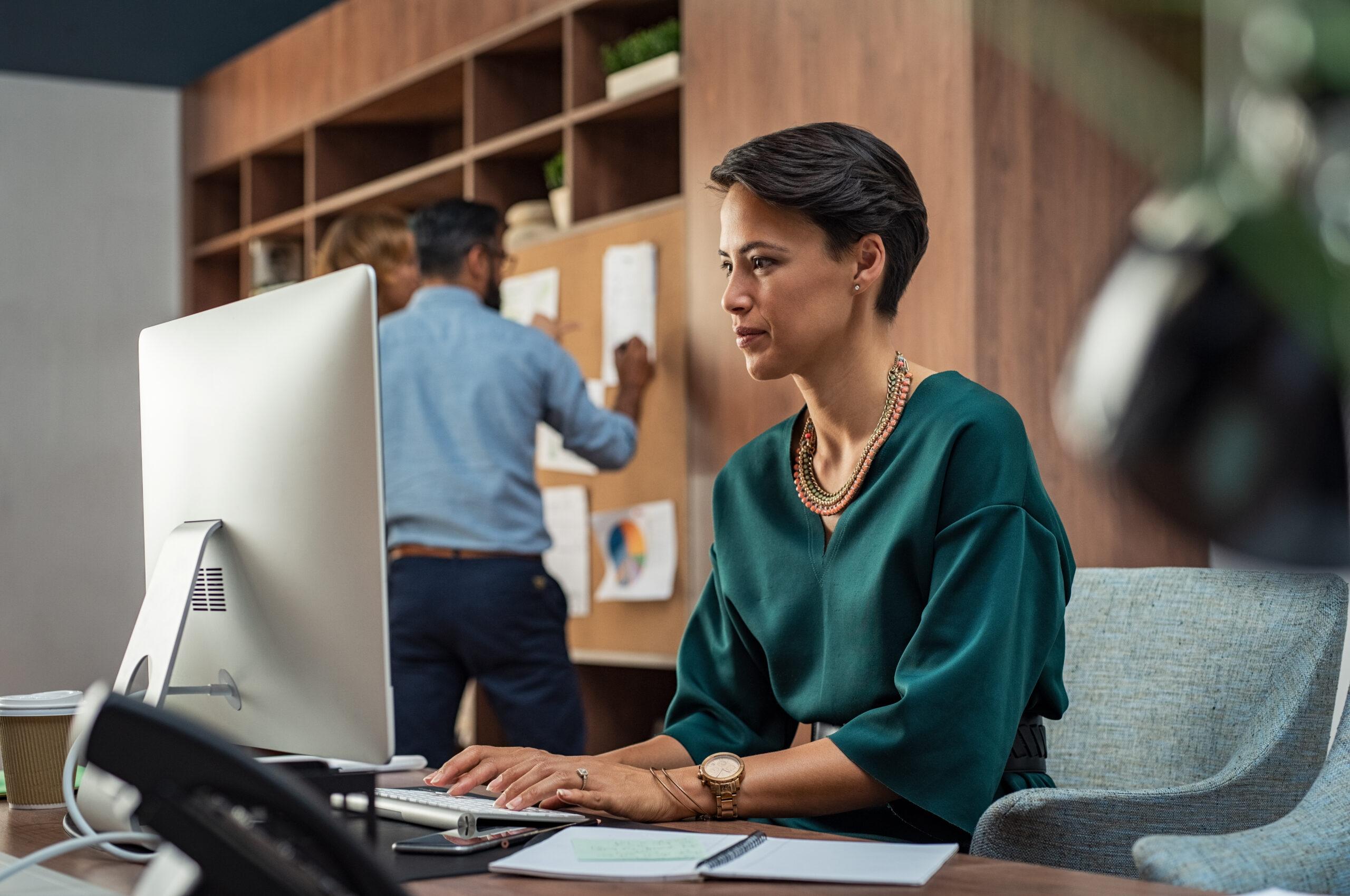 Young creative woman working on computer