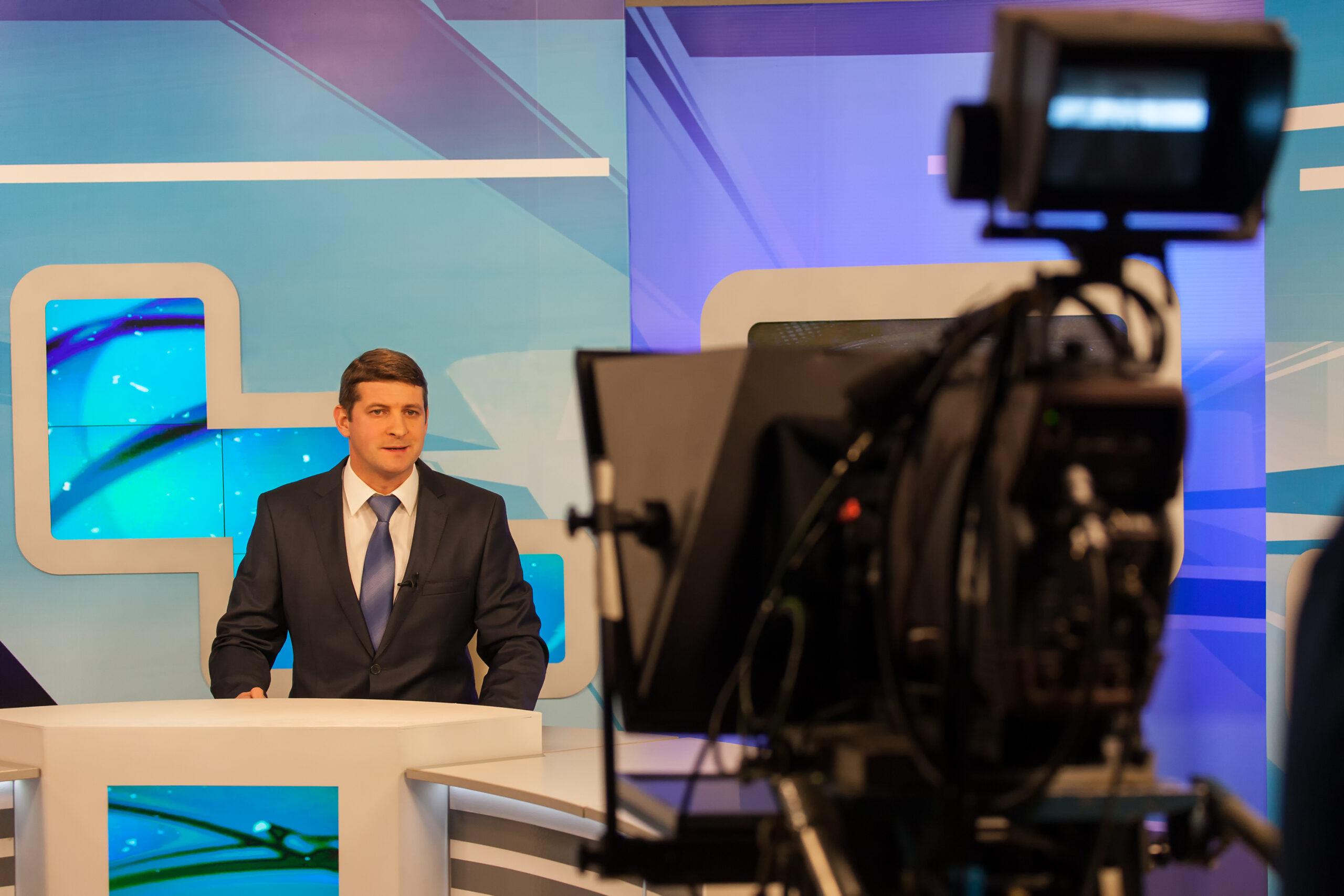 tv studio camera recording male reporter or anchorman. Live broa