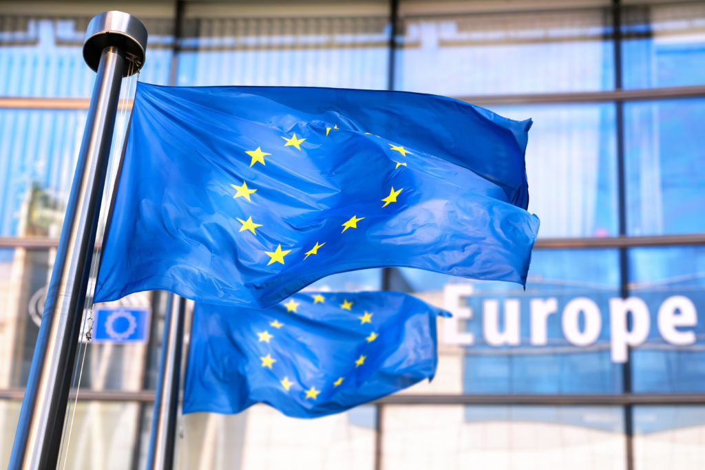 European Union flags waving in front of European Commission.