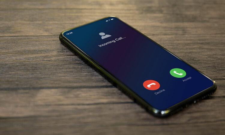 iPhone ringing with Apple's iconic end call and answer call buttons displayed