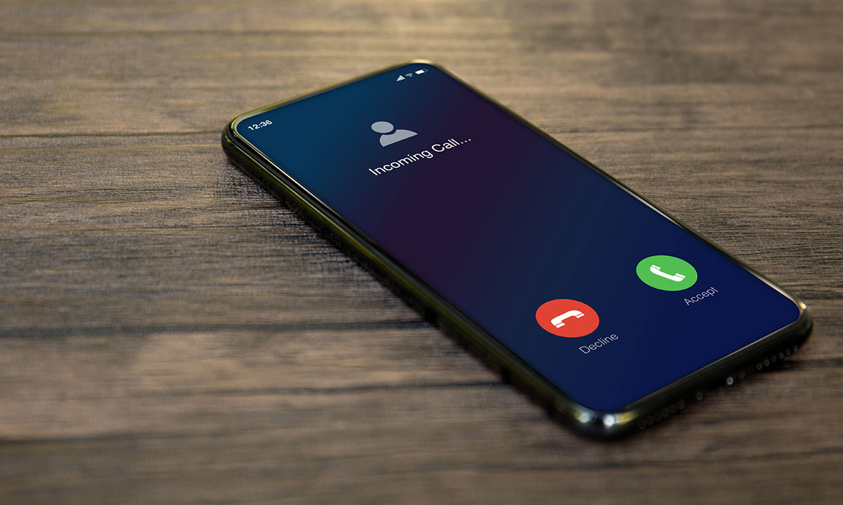 iPhone ringing with Apple's iconic end call and answer call buttons displayed