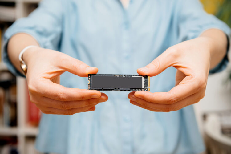 Woman holding new NVME PCIE SSD with two hands