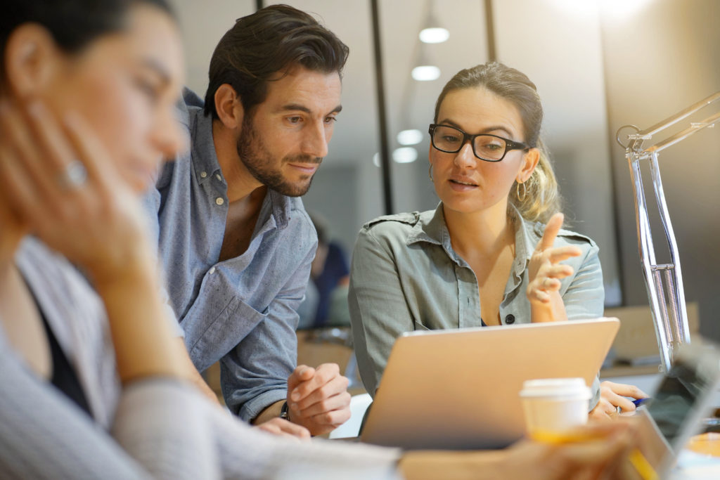 Colleagues in modern coworking space