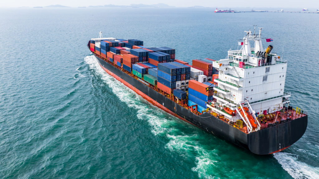 Aerial view of a cargo ship sailing.