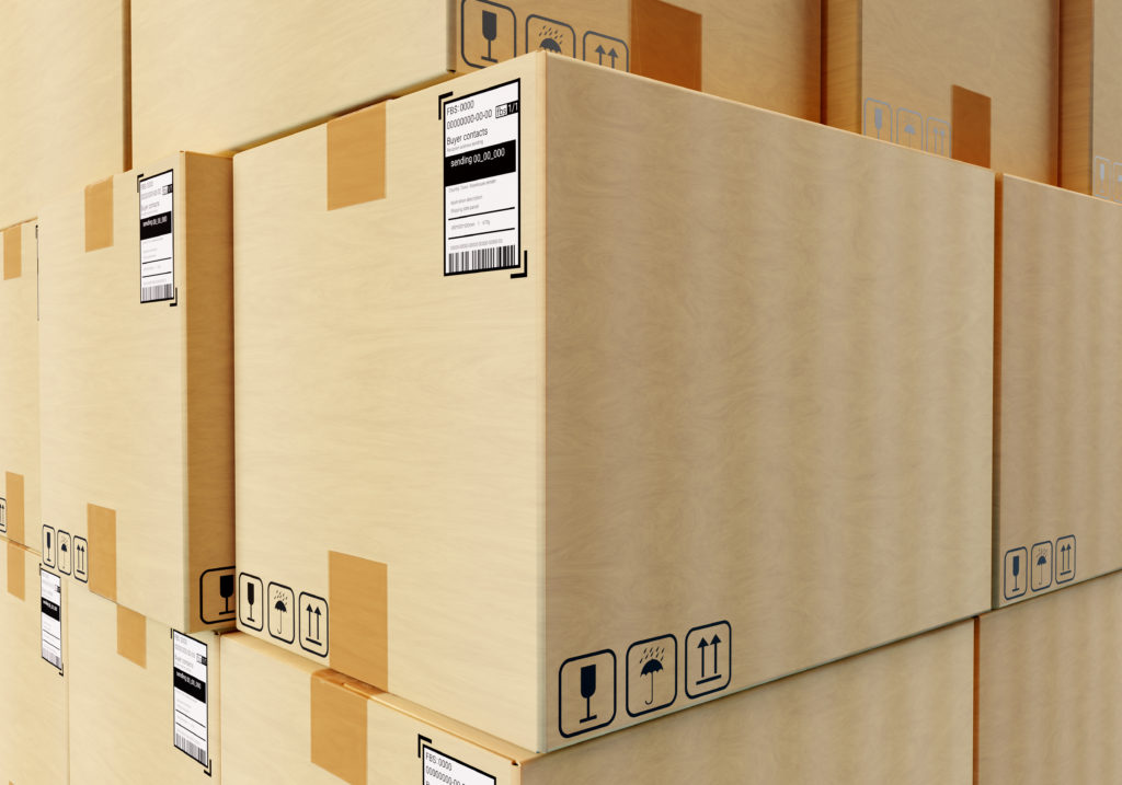 Boxes with barcodes in logistics center. Cardboard boxes with information stic