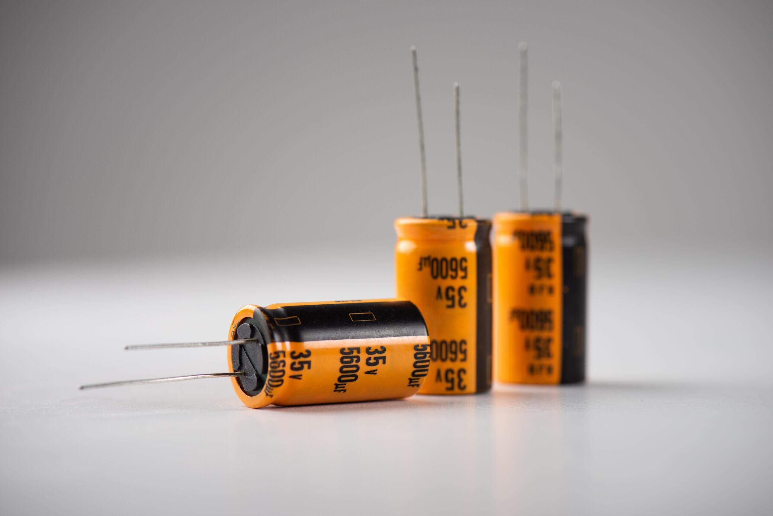 Capacitor, electronic parts