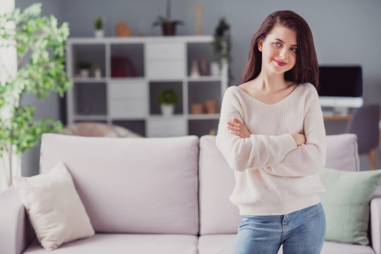 attractive woman smiling crossed hands in the living room