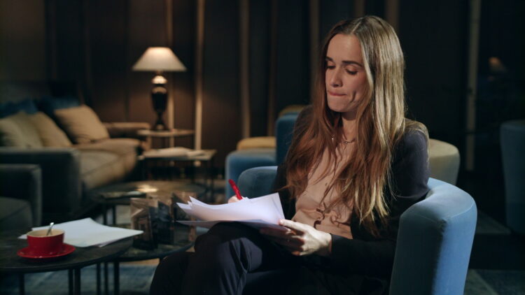 anxious woman looking at documents