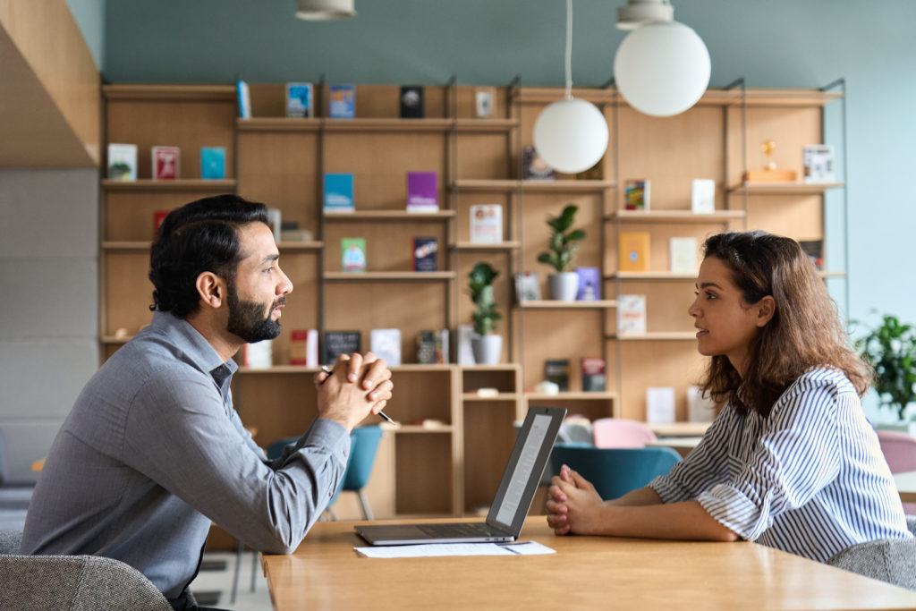 Boss having a serious conversation with employee.