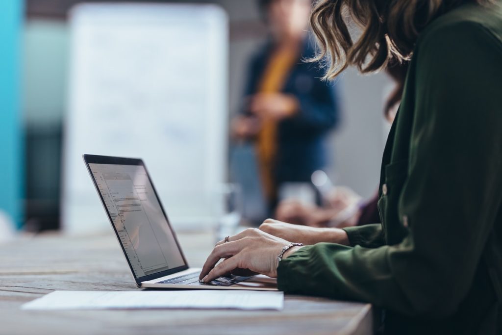  Female executive using laptop