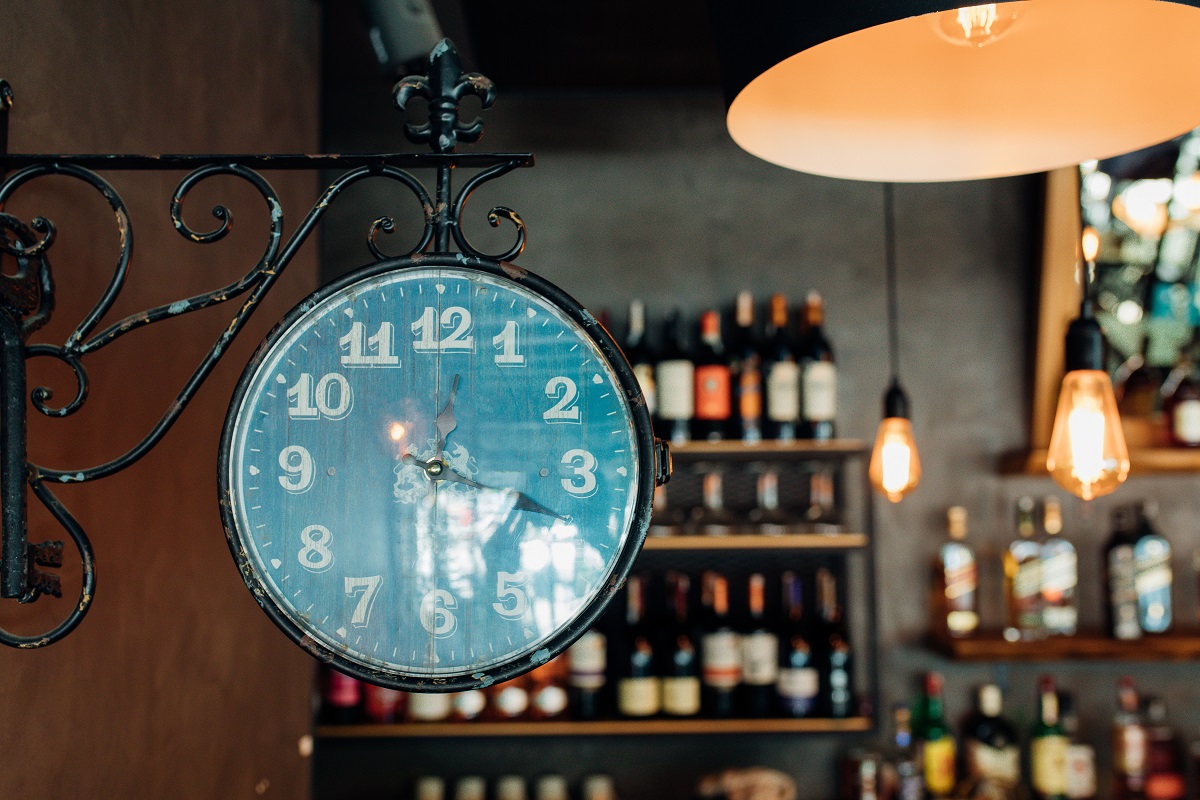old wall clock and vintage luxury interior lighting decor at restaurant