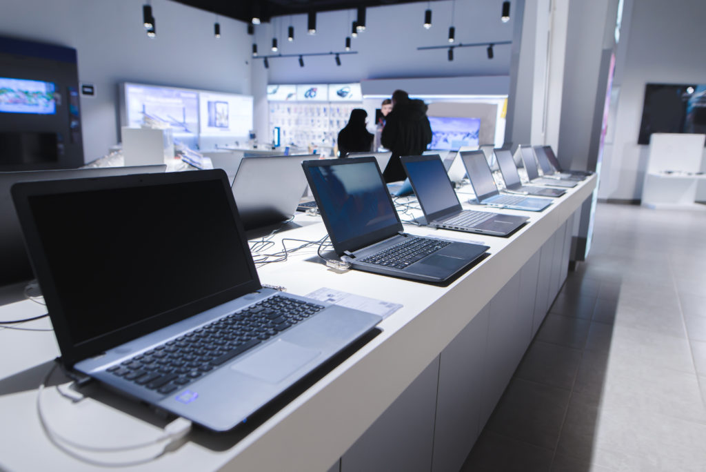 Laptops in a modern technology store.