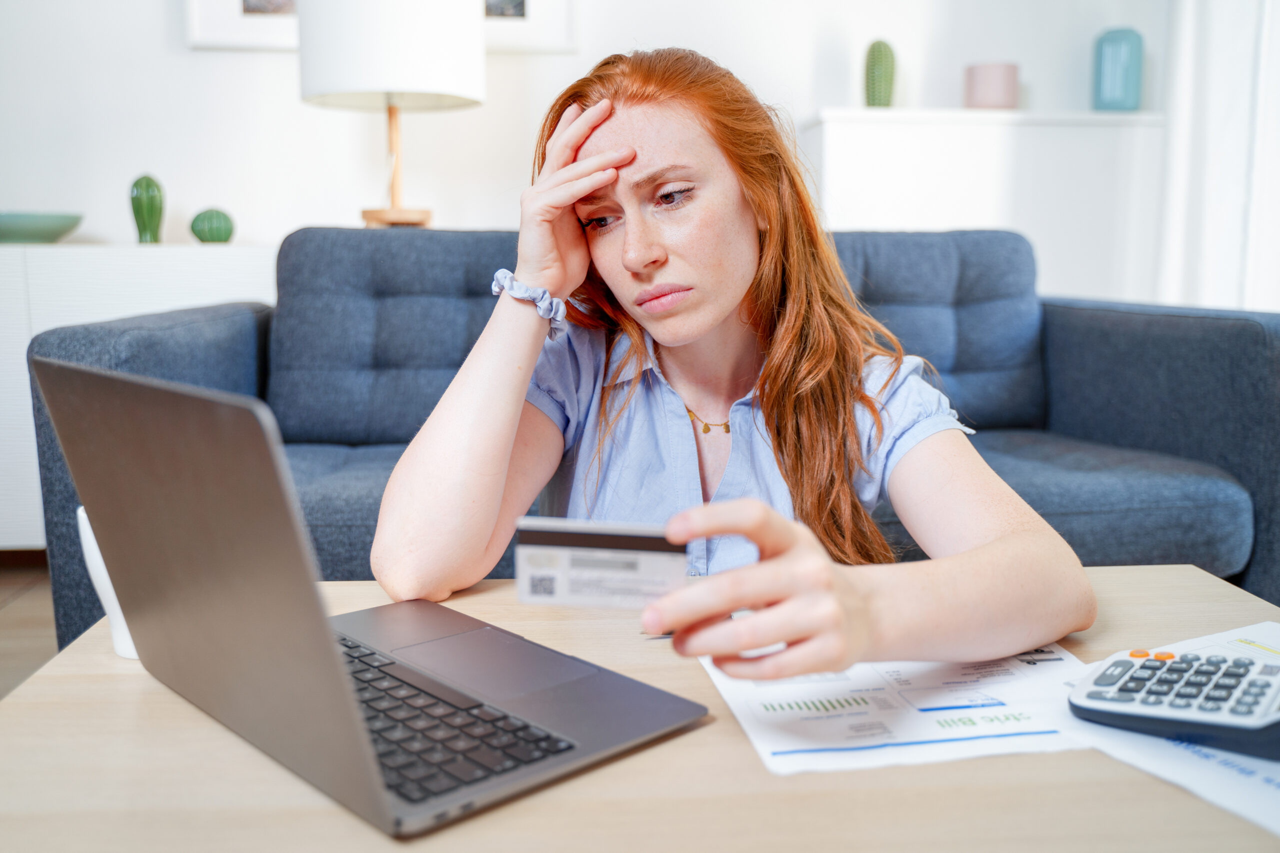 Sad woman checking bank account still in the red