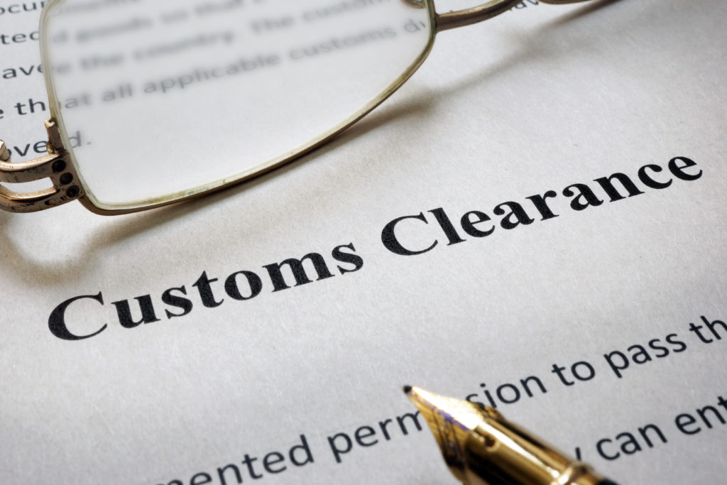 Customs clearance document with glasses.
