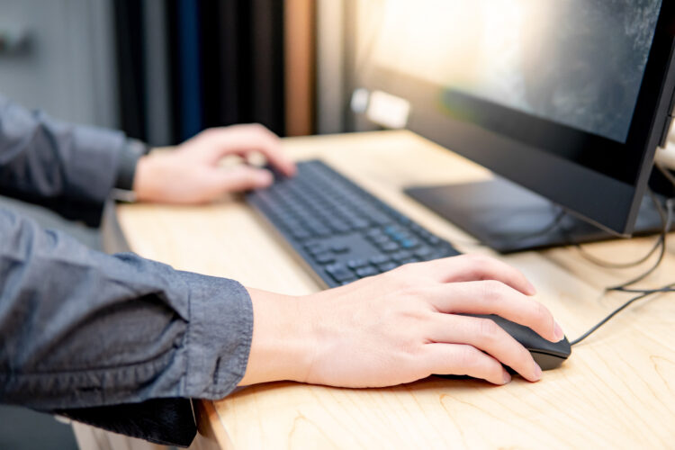 Holding computer mouse while using computer