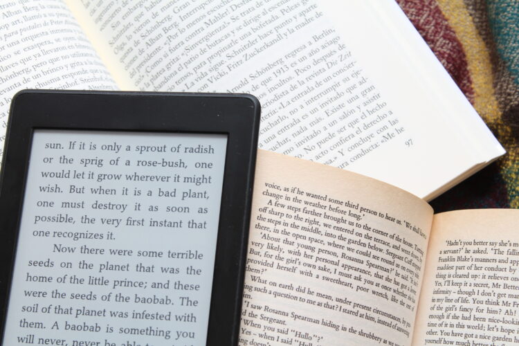 e-book reader on paper books