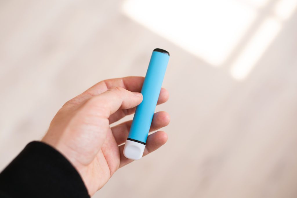 Disposable blue colored e-cigarette.