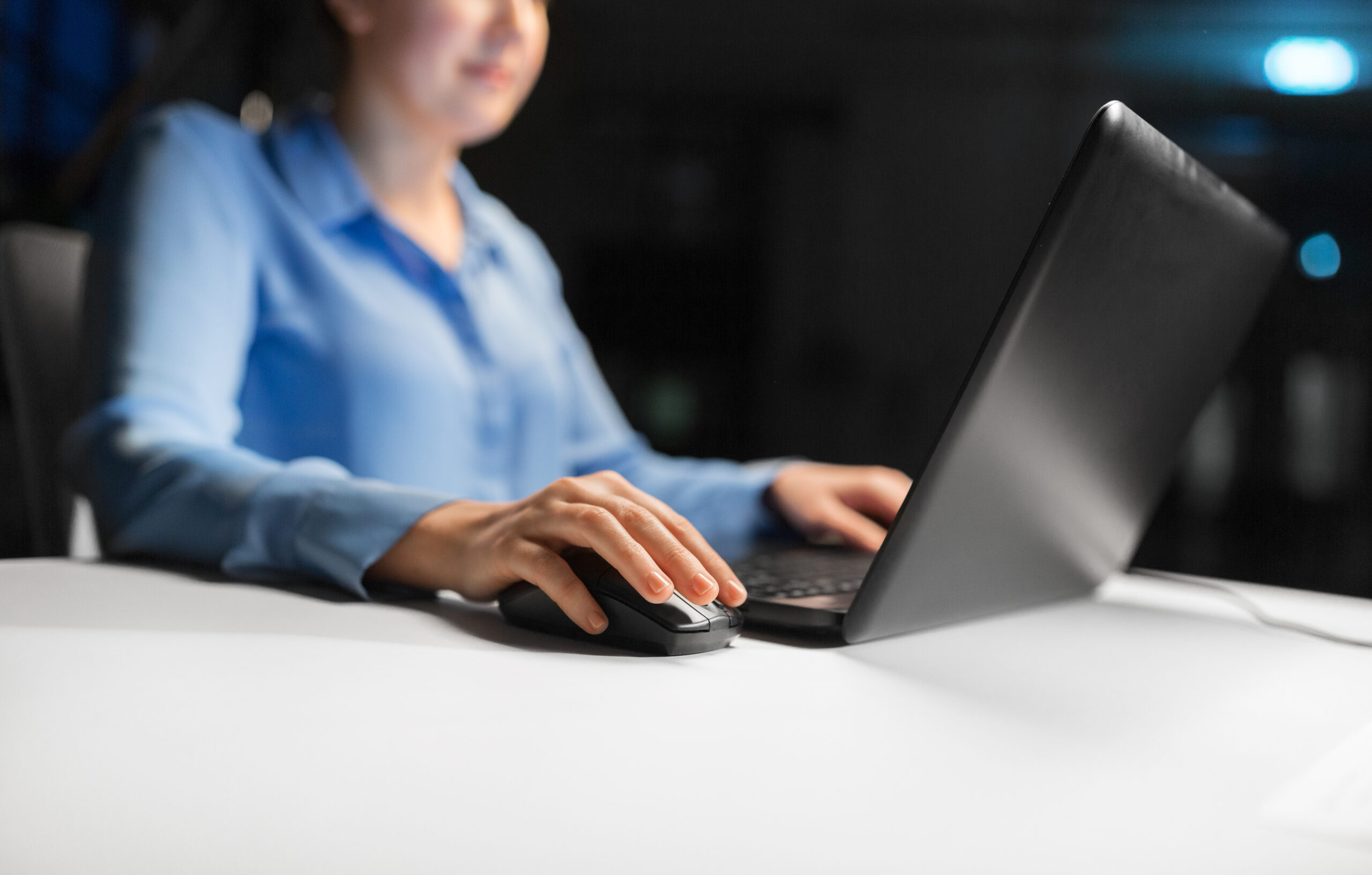 close up of businesswoman using computer mouse