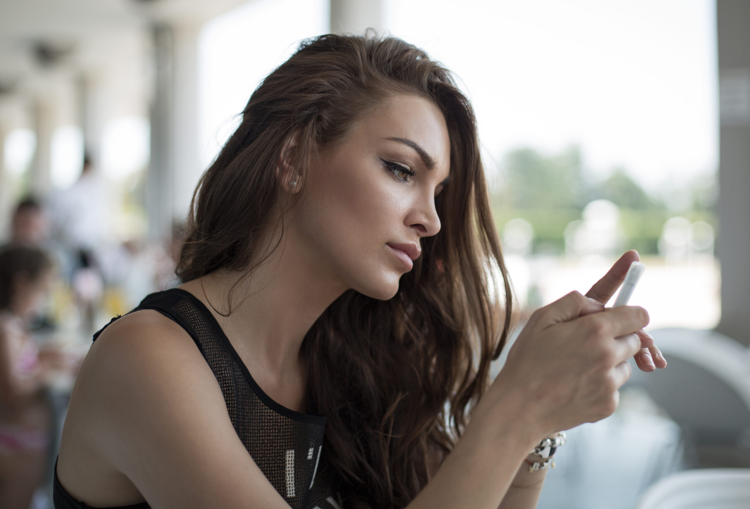 Woman sending a message with her smartphone