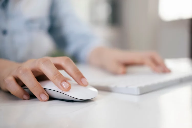 female hand using keyboard and mouse