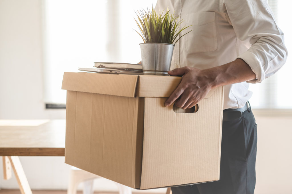 Employee moving out from office after termination.