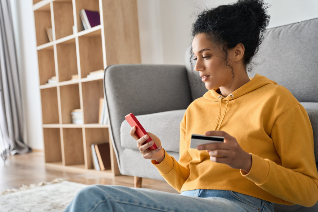 Female e-commerce consumer with credit card.