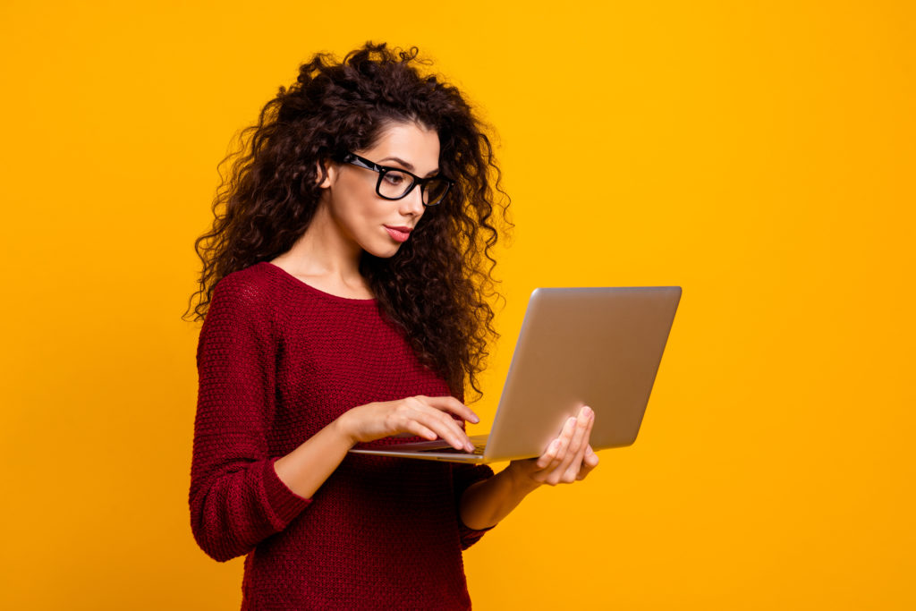 Woman using a laptop.