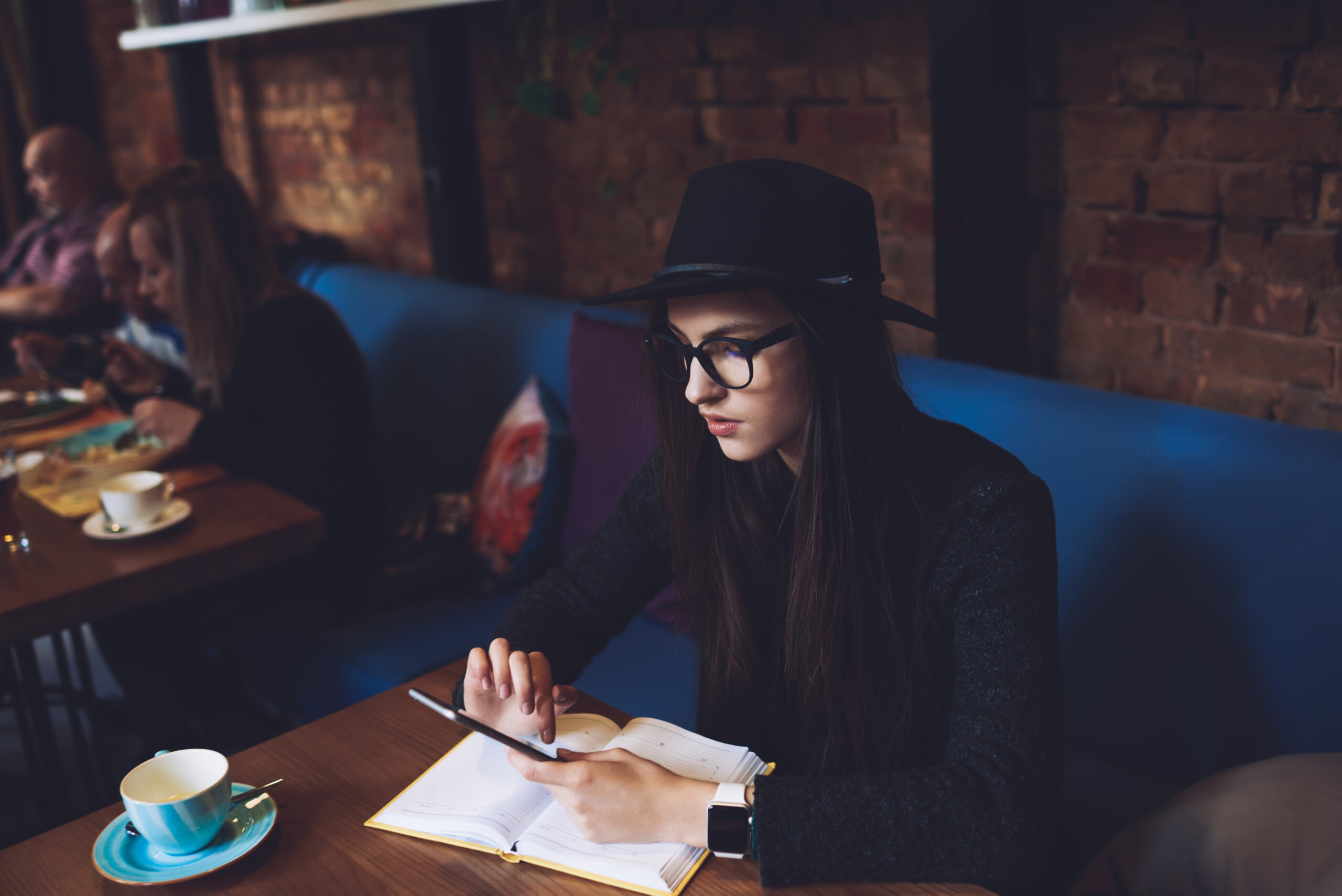 Pensive woman messaging on smartphone