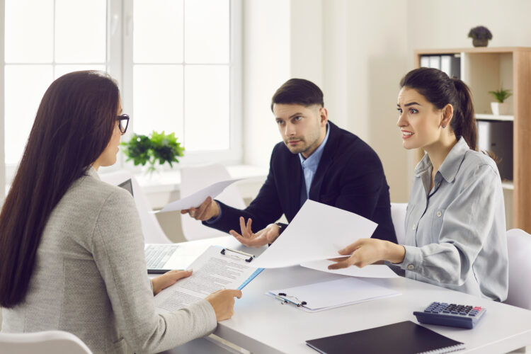 Woman angry at man regarding a document