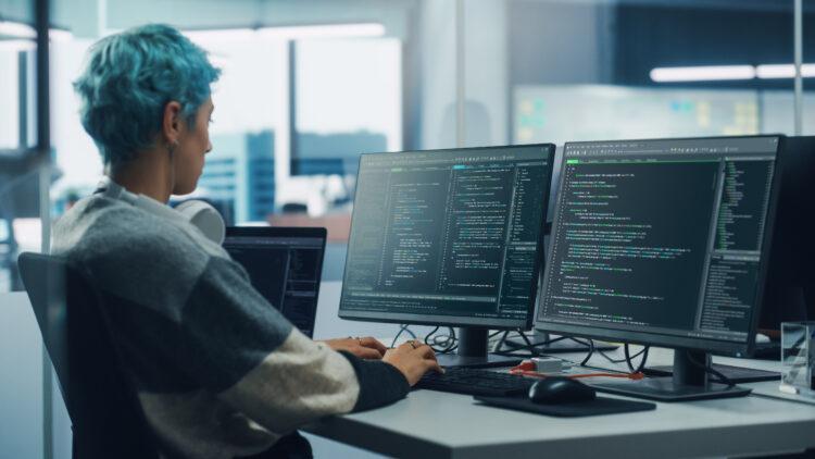 female programmer working at her desk