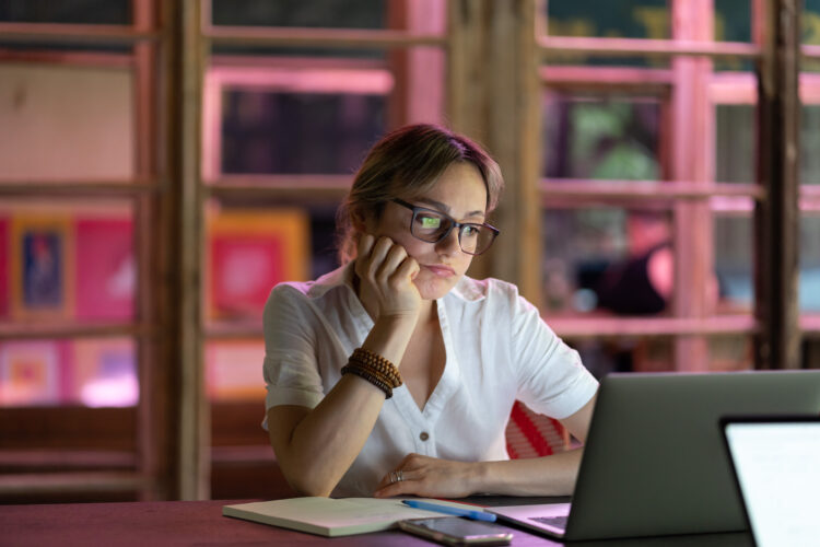 Upset unhappy woman employee looking at laptop screen