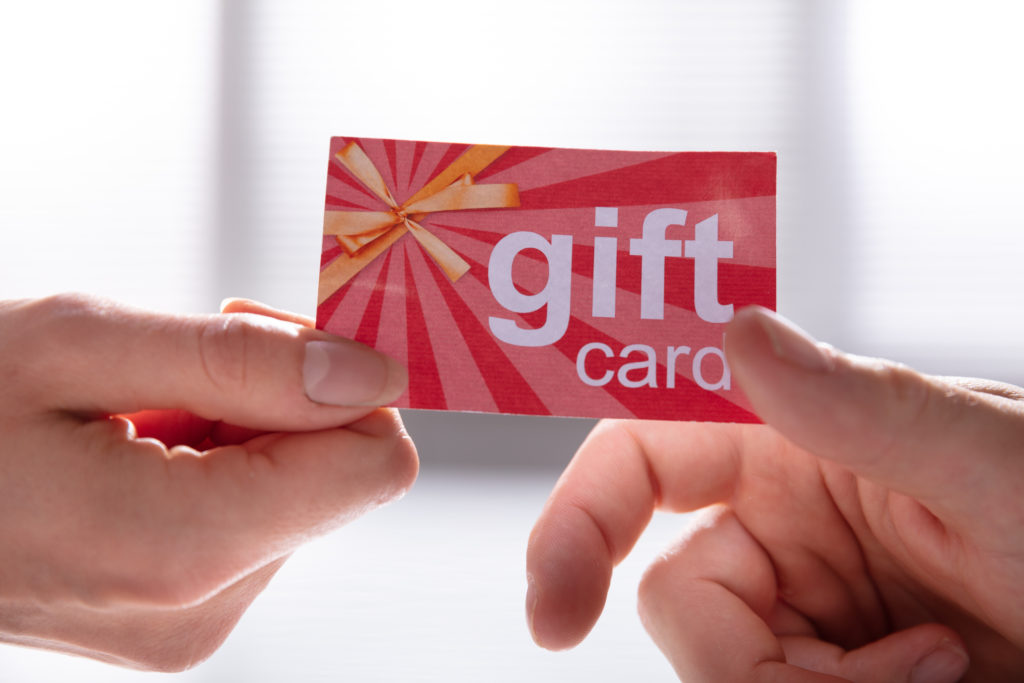 Handing gift card.