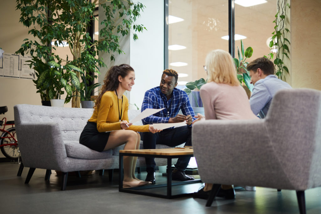 Group of office workers in a discussion.