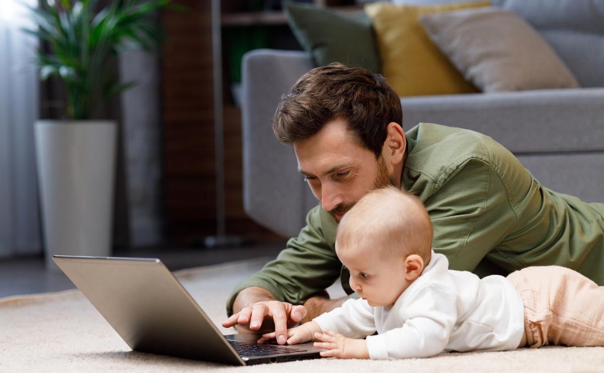 stay-at-home dad playing with baby