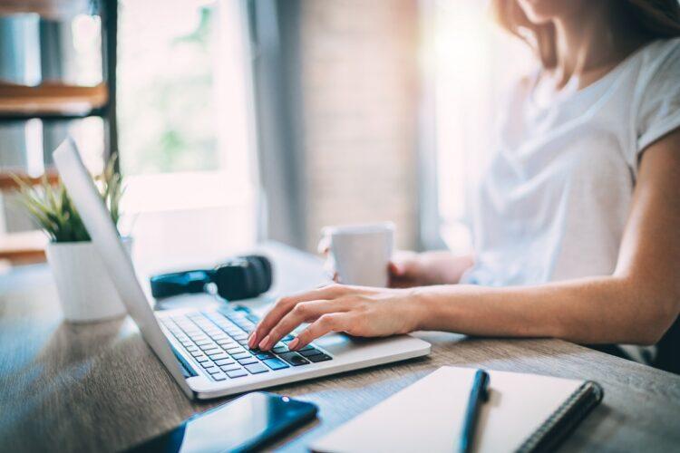 Woman checking something on laptop