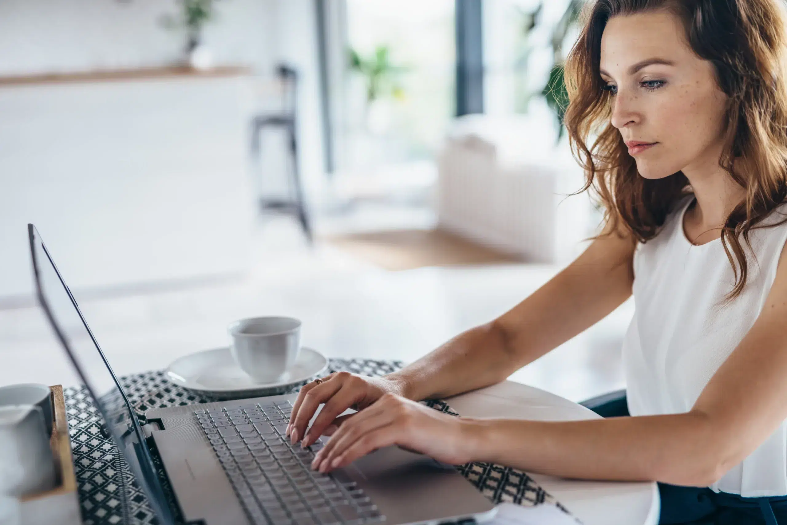 Portrait of a young woman looking at laptop