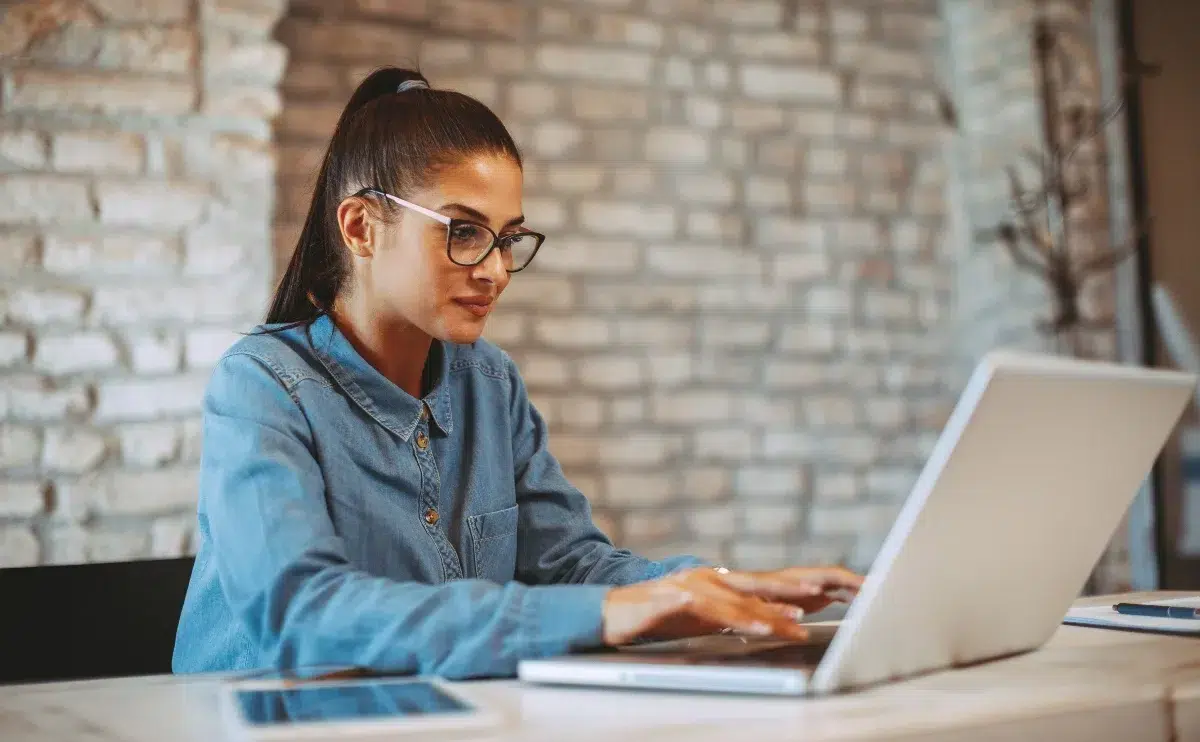 Young woman working on laptop in the office